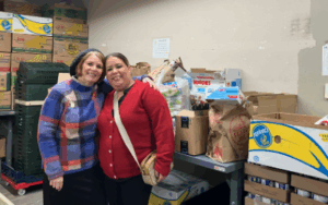 Two women with food donations